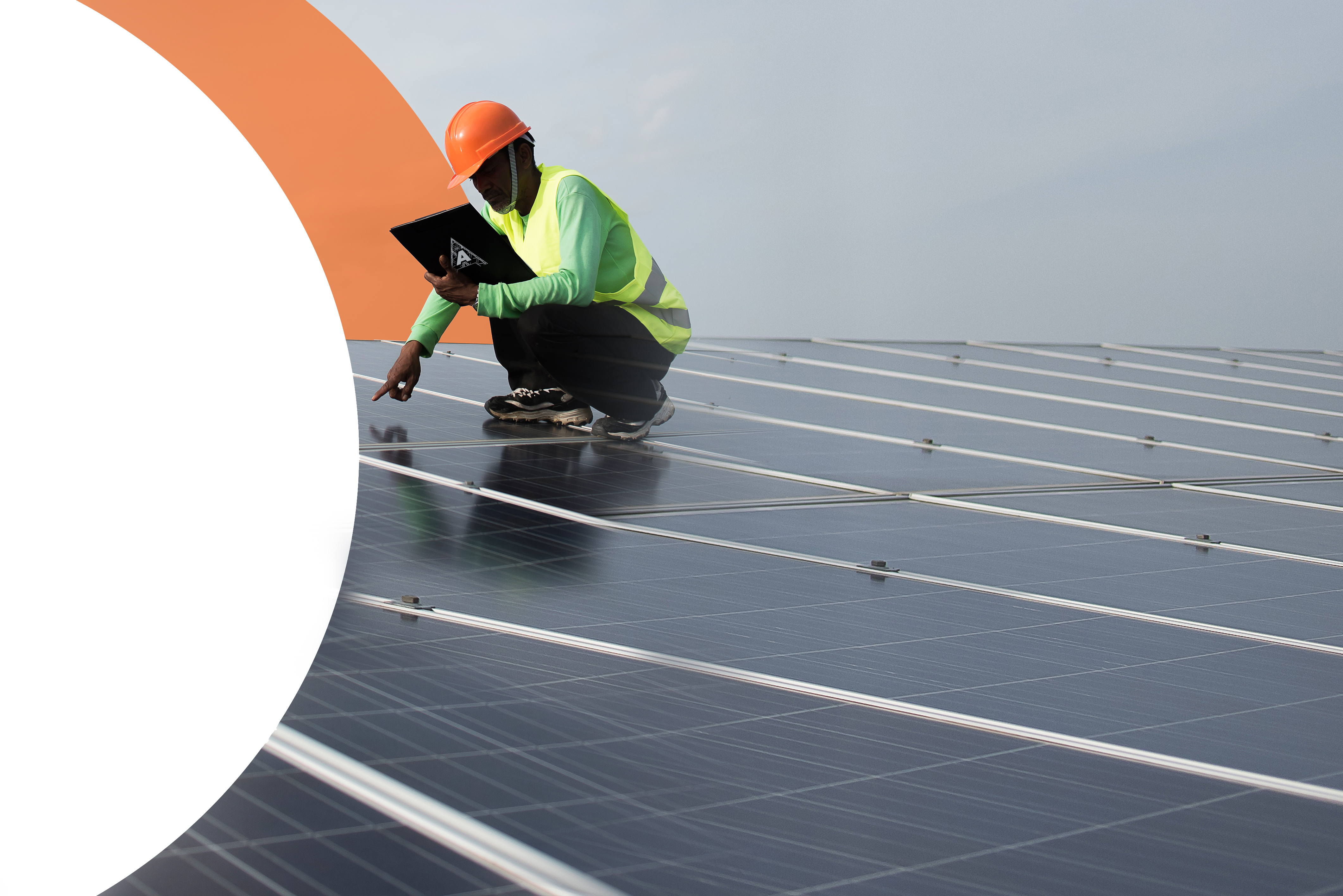 African american technician checks the maintenance of the solar panels. Group of three black engineers meeting at solar station.